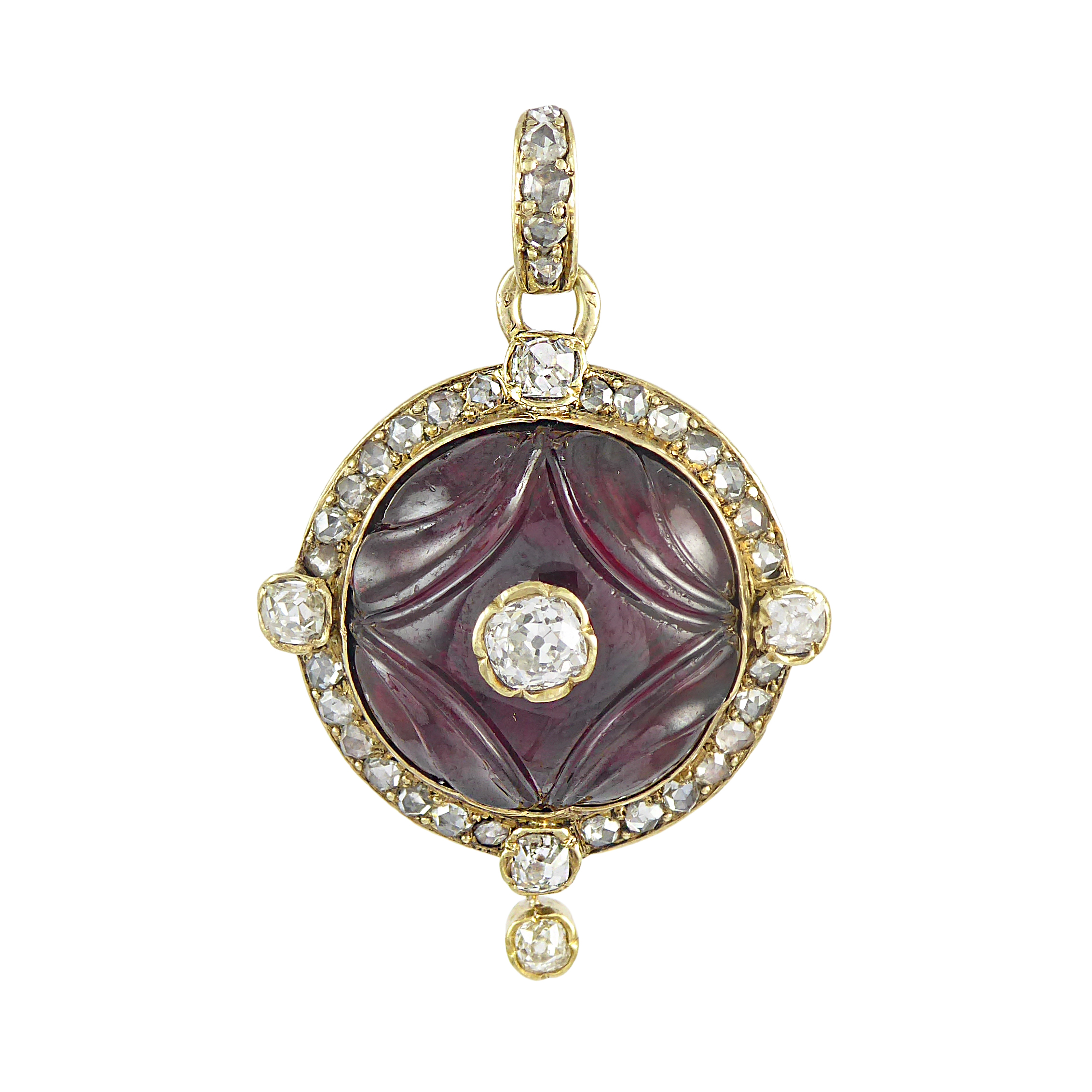 Late 19th century circular carved garnet and diamond cluster pendant, French c.1890,